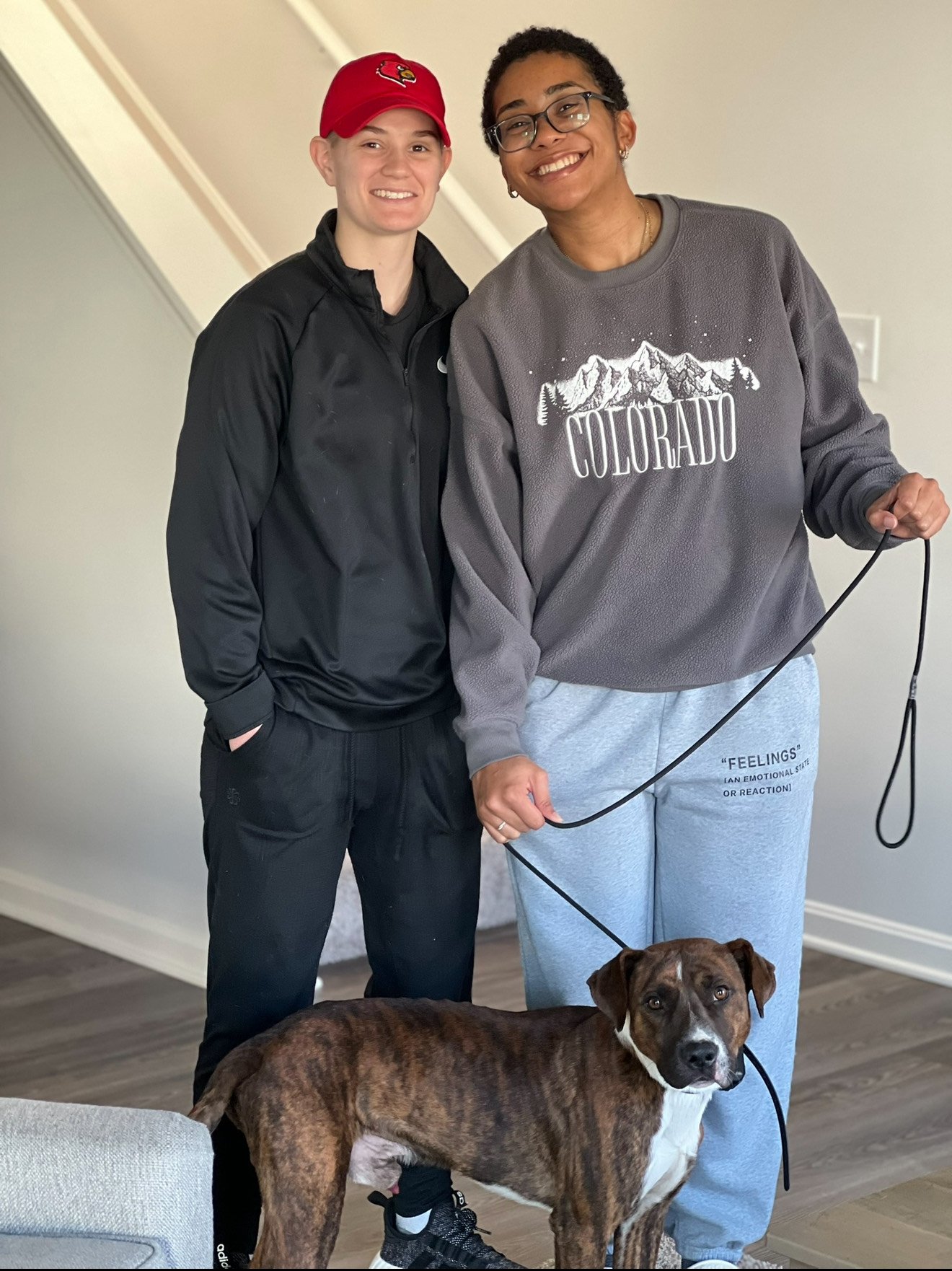 Placeholder — hero photo of Dixie, a focused mixed-breed dog on a slip lead, calm and attentive in a public park setting.